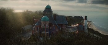 Movie still from “Artemis Fowl” (2020), directed by Kenneth Branagh – A large building with a green dome on the top of it; Extreme Wide shot, Low angle