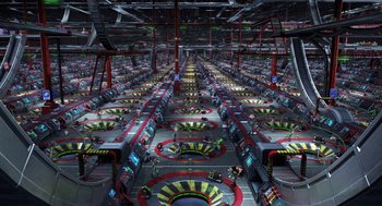 Movie still from “Arthur Christmas” (2011), directed by Barry Cook – A large room filled with lots and lots of machines; Extreme Wide shot, High angle