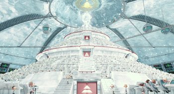 Movie still from “Arthur Christmas” (2011), directed by Barry Cook – An image of a very large building with a lot of people inside it; Extreme Wide shot, High angle