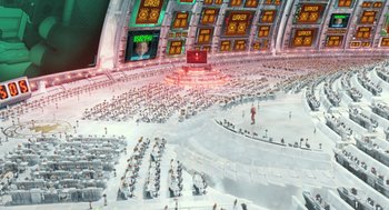 Movie still from “Arthur Christmas” (2011), directed by Barry Cook – An audience is sitting in an auditorium in a stadium; Extreme Wide shot, High angle
