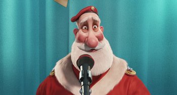 Movie still from “Arthur Christmas” (2011), directed by Barry Cook – An animated man with a beard and a red hat is holding a microphone; Close Up shot, Low angle