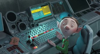 Movie still from “Arthur Christmas” (2011), directed by Barry Cook – An animated character sitting in front of a computer keyboard; Medium shot, High angle