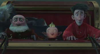 Movie still from “Arthur Christmas” (2011), directed by Barry Cook – A group of people standing next to each other in a room; Medium shot, Low angle