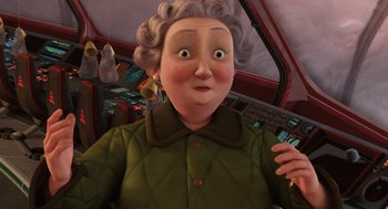 Movie still from “Arthur Christmas” (2011), directed by Barry Cook – An old woman with gray curly hair and a green jacket; Close Up shot, High angle