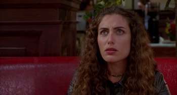 Movie still from “As Good as It Gets” (1997), directed by James L. Brooks – A person sitting on a chair; Close Up shot, Over the shoulder angle