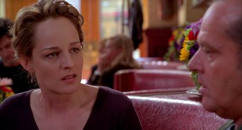 Movie still from “As Good as It Gets” (1997), directed by James L. Brooks – A person sitting in a booth; Close Up shot, Over the shoulder angle