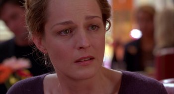 Movie still from “As Good as It Gets” (1997), directed by James L. Brooks – A person with a serious look on their face; Close Up shot, Over the shoulder angle