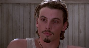 Movie still from “As Good as It Gets” (1997), directed by James L. Brooks – A person with long hair; Close Up shot, Low angle