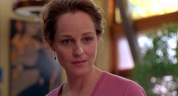 Movie still from “As Good as It Gets” (1997), directed by James L. Brooks – A person wearing a pink shirt; Close Up shot, Over the shoulder angle