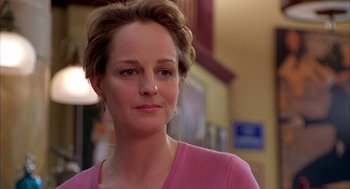 Movie still from “As Good as It Gets” (1997), directed by James L. Brooks – A person wearing a pink shirt; Close Up shot, Over the shoulder angle