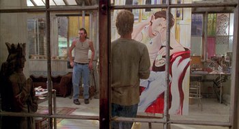 Movie still from “As Good as It Gets” (1997), directed by James L. Brooks – Two men standing in front of a painting of a woman; Wide shot, Over the shoulder angle