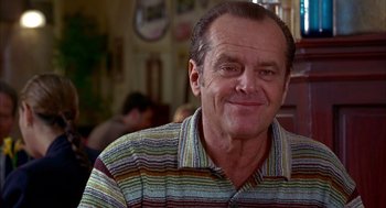 Movie still from “As Good as It Gets” (1997), directed by James L. Brooks – An older man wearing a striped shirt smiling for the camera; Close Up shot, Over the shoulder angle