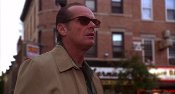 Movie still from “As Good as It Gets” (1997), directed by James L. Brooks – A person wearing a jacket and sunglasses; Close Up shot, Low angle