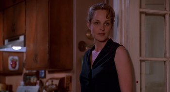 Movie still from “As Good as It Gets” (1997), directed by James L. Brooks – A woman standing in front of a wall; Close Up shot, Over the shoulder angle