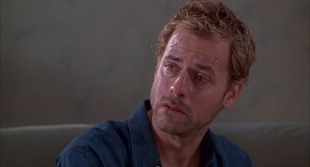 Movie still from “As Good as It Gets” (1997), directed by James L. Brooks – A person sitting down with his eyes closed; Close Up shot, Low angle