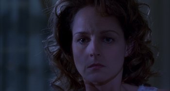 Movie still from “As Good as It Gets” (1997), directed by James L. Brooks – A woman's face in the dark; Close Up shot, Low angle