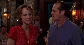 Movie still from “As Good as It Gets” (1997), directed by James L. Brooks – A man and a woman standing next to each other in a room; Medium shot, Over the shoulder angle