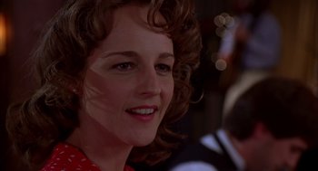 Movie still from “As Good as It Gets” (1997), directed by James L. Brooks – A person with curly hair; Close Up shot, Over the shoulder angle