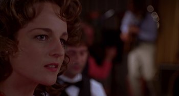 Movie still from “As Good as It Gets” (1997), directed by James L. Brooks – A person wearing a suit and tie; Close Up shot, Over the shoulder angle