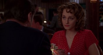 Movie still from “As Good as It Gets” (1997), directed by James L. Brooks – A woman in a polka dot dress sitting in front of a man; Close Up shot, Over the shoulder angle