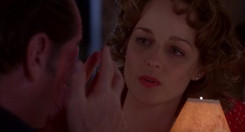 Movie still from “As Good as It Gets” (1997), directed by James L. Brooks – A person touching a woman's face; Close Up shot, Over the shoulder angle