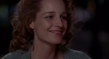 Movie still from “As Good as It Gets” (1997), directed by James L. Brooks – A person smiling; Close Up shot, Over the shoulder angle