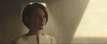 Movie still from “Assassin's Creed” (2016), directed by Justin Kurzel – A woman in a white shirt is looking at the camera; Close Up shot, Low angle