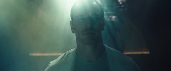Movie still from “Assassin's Creed” (2016), directed by Justin Kurzel – A man with his eyes closed in the sunlight; Close Up shot, Low angle
