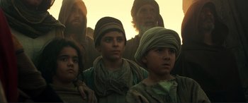 Movie still from “Assassin's Creed” (2016), directed by Justin Kurzel – A group of people standing next to each other; Medium shot, Low angle