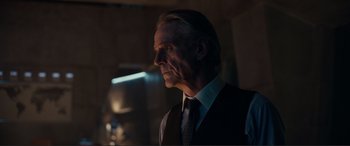 Movie still from “Assassin's Creed” (2016), directed by Justin Kurzel – A man in a vest and tie looking off into the distance; Close Up shot, Over the shoulder angle