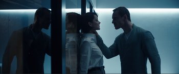 Movie still from “Assassin's Creed” (2016), directed by Justin Kurzel – A man and a woman standing next to each other in a room; Medium shot, Low angle