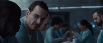 Movie still from “Assassin's Creed” (2016), directed by Justin Kurzel – A group of people sitting in a room; Close Up shot, Over the shoulder angle
