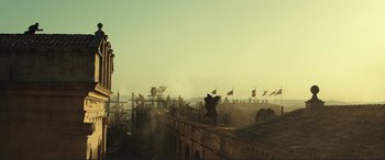 Movie still from “Assassin's Creed” (2016), directed by Justin Kurzel – An image of an outdoor scene with flags flying in the background; Extreme Wide shot, Low angle
