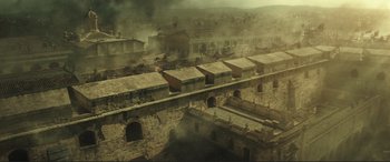 Movie still from “Assassin's Creed” (2016), directed by Justin Kurzel – An aerial view of an ancient city with buildings; Extreme Wide shot, High angle