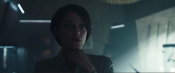 Movie still from “Assassin's Creed” (2016), directed by Justin Kurzel – A woman with short dark hair wearing a dress shirt; Close Up shot, Low angle