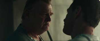 Movie still from “Assassin's Creed” (2016), directed by Justin Kurzel – An older man and a younger man face to face; Close Up shot, Over the shoulder angle
