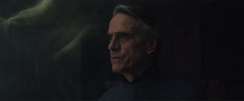 Movie still from “Assassin's Creed” (2016), directed by Justin Kurzel – An older man is looking out a window; Close Up shot, Low angle