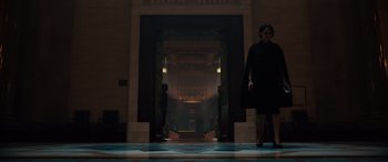 Movie still from “Assassin's Creed” (2016), directed by Justin Kurzel – A woman walking down a hall way in a building; Extreme Wide shot, Low angle