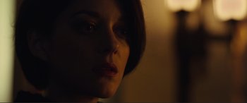 Movie still from “Assassin's Creed” (2016), directed by Justin Kurzel – A woman's face in a dimly - lit room; Close Up shot, Low angle