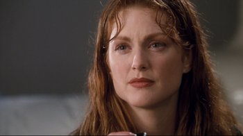 Movie still from “Assassins” (1995), directed by Richard Donner – A person with wet hair; Close Up shot, Low angle