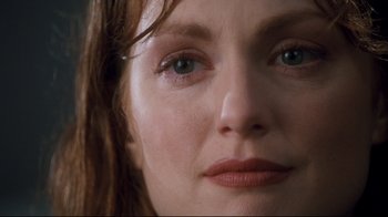 Movie still from “Assassins” (1995), directed by Richard Donner – A woman's eyes and face; Extreme Close Up shot, Low angle