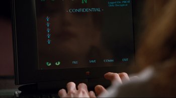Movie still from “Assassins” (1995), directed by Richard Donner – A computer screen with a cat's eyes on it; Extreme Close Up shot, Over the shoulder angle