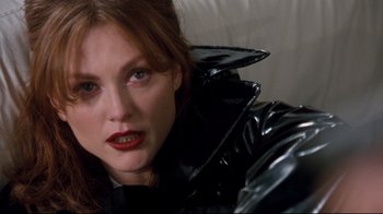 Movie still from “Assassins” (1995), directed by Richard Donner – A person wearing a leather jacket; Close Up shot, High angle