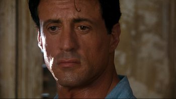 Movie still from “Assassins” (1995), directed by Richard Donner – Sylvester stallone's face; Close Up shot, Over the shoulder angle