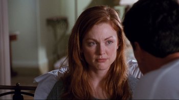 Movie still from “Assassins” (1995), directed by Richard Donner – A person with long red hair; Close Up shot, Over the shoulder angle