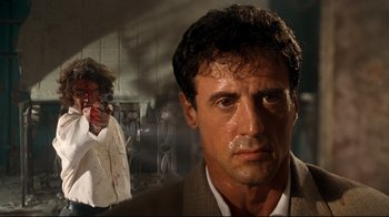 Movie still from “Assassins” (1995), directed by Richard Donner – Sylvester stallone in a scene from the movie rocky; Close Up shot, Over the shoulder angle
