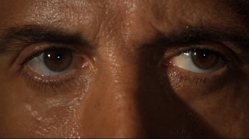 Movie still from “Assassins” (1995), directed by Richard Donner – View of a man's eyes; Extreme Close Up shot, Overhead angle
