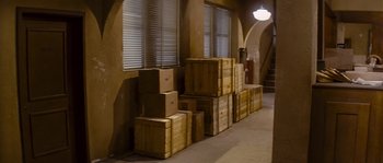 Movie still from “Assault on Precinct 13” (1976), directed by John Carpenter – A room filled with lots of cardboard boxes stacked on top of each other; Wide shot, High angle