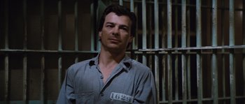 Movie still from “Assault on Precinct 13” (1976), directed by John Carpenter – A man standing in front of a jail cell; Close Up shot, High angle