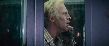 Movie still from “Assault on Precinct 13” (1976), directed by John Carpenter – A person talking on a phone; Close Up shot, Low angle